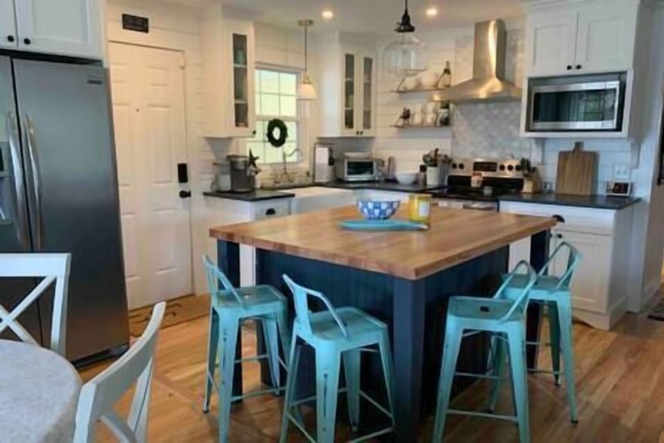 Dine at the huge island in the well stocked kitchen