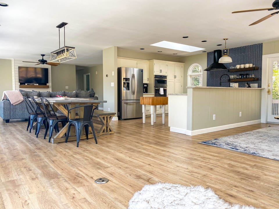Open Kitchen to Dining with Farmhouse Table for 8 - 10 and opens to Living area