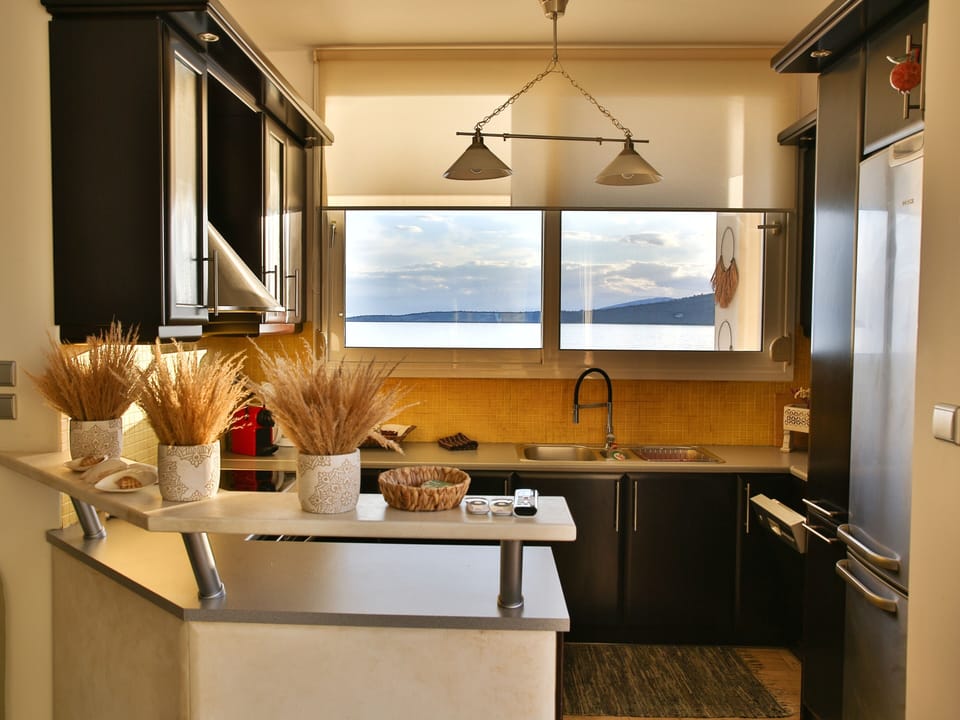 Modern kitchen with large window 