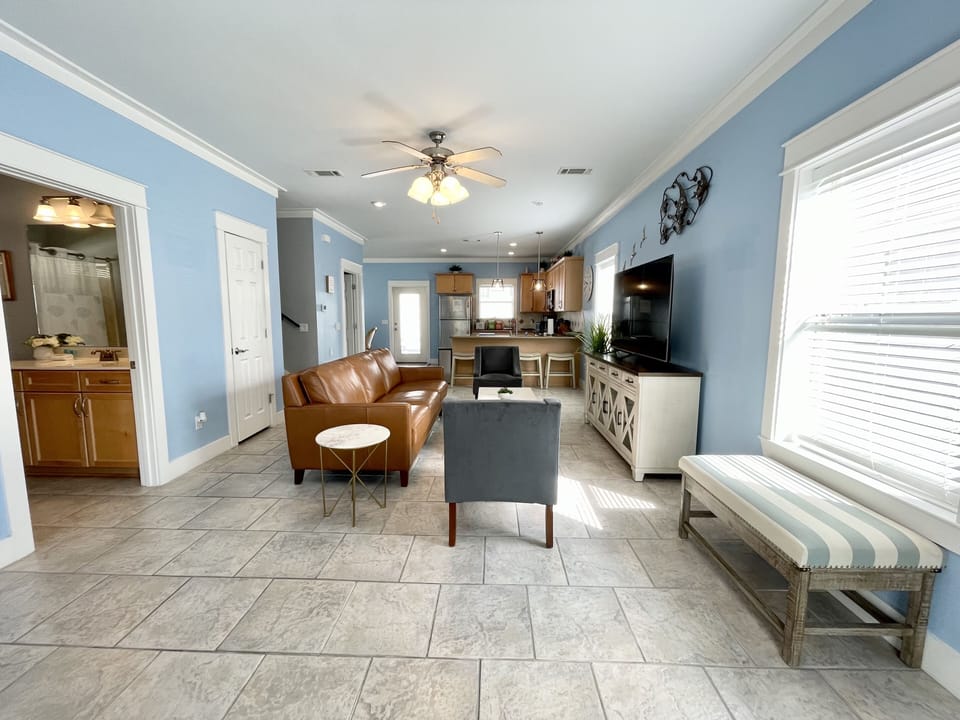 Open floor plan with living room and kitchen. Comfortable seating to relax. 