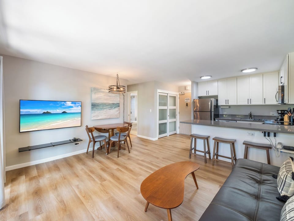 Living Room - Experience easy island living with a bright open layout—cook, dine, and relax all in one comfortable Waikiki condo.