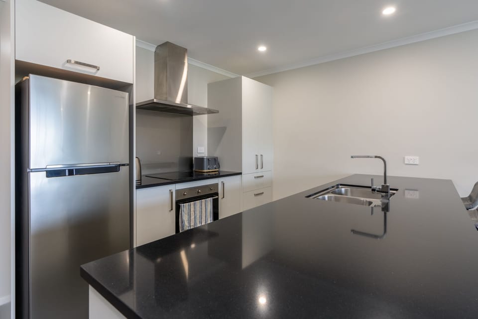 Kitchen stocked with appliances.