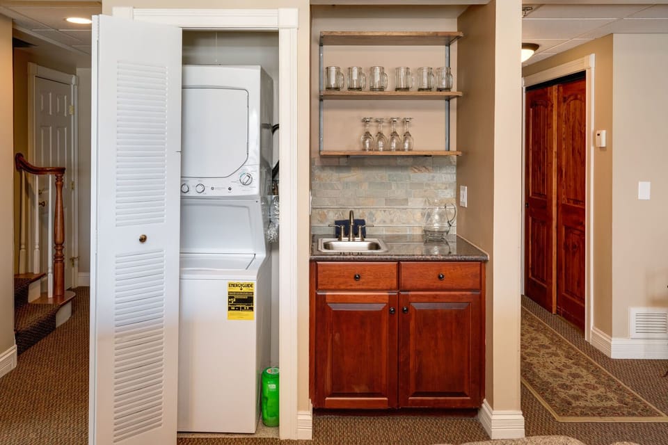 Washer and dryer behind the accordion door, Dedicated wet bar for happy hour.