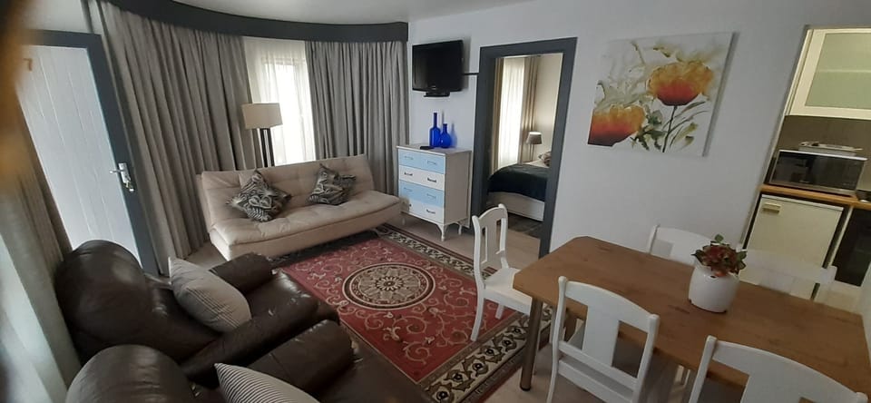 Family Apartment | Living area | 55-inch LCD TV with satellite channels, TV