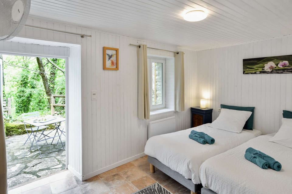 A comfortable room with a small shaded terrace
