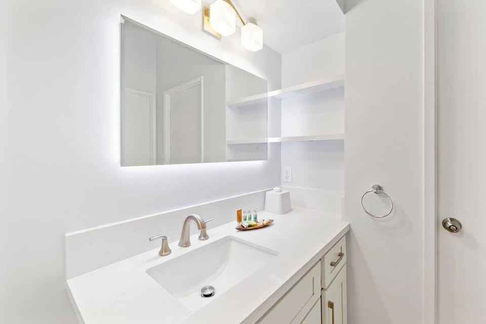 Bathroom with a vanity and a cabinet.