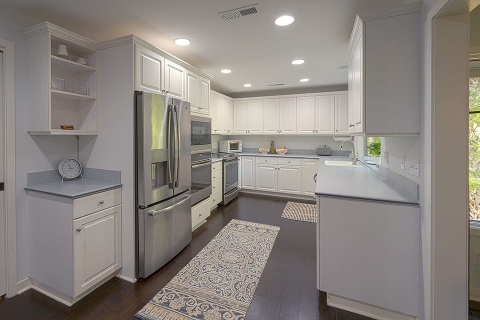 Kitchen with double ovens and newer appliances
