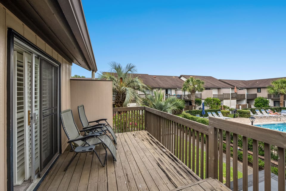The town home has a spacious balcony on the upper level.