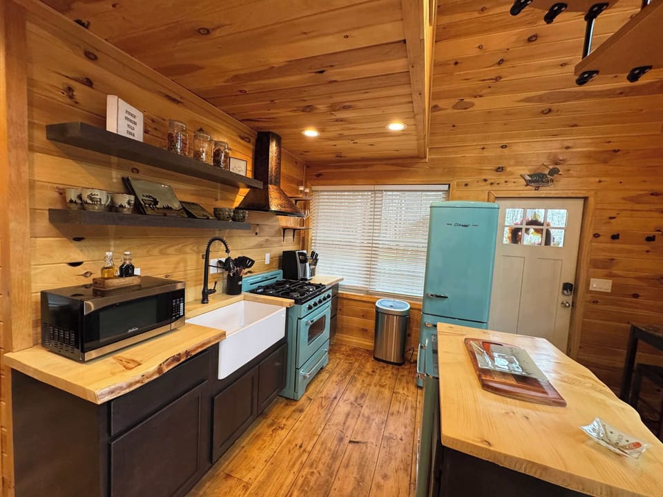 Rustic charm meets retro flair. Your fully equipped kitchen has everything you need to dine in style.