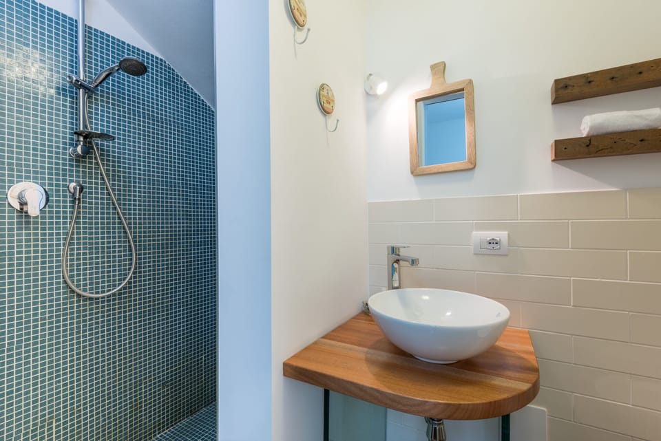 Basic Double Room | Bathroom | Shower, hair dryer, bidet, soap