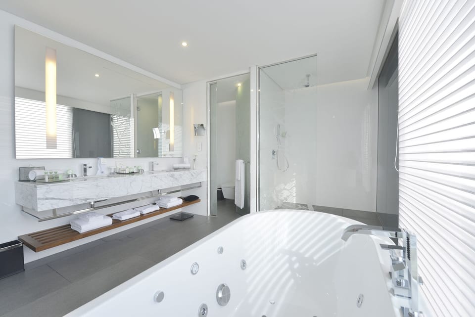 Separate tub and shower, free toiletries, bathrobes, slippers