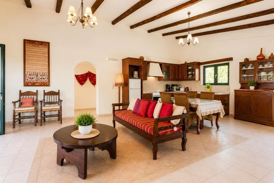 Open-plan living room with dining area, kitchen, WiFi internet, satellite TV, DVD player, and pool terrace access
