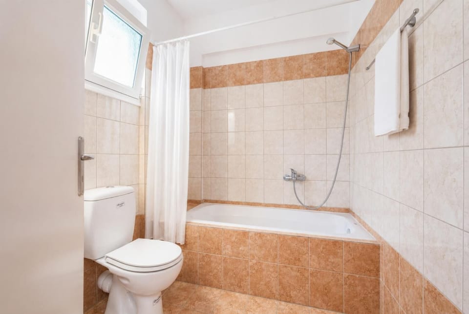 En suite bathroom with bath and shower