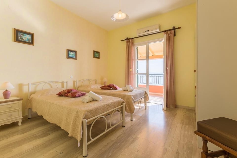 Twin bedroom with balcony access