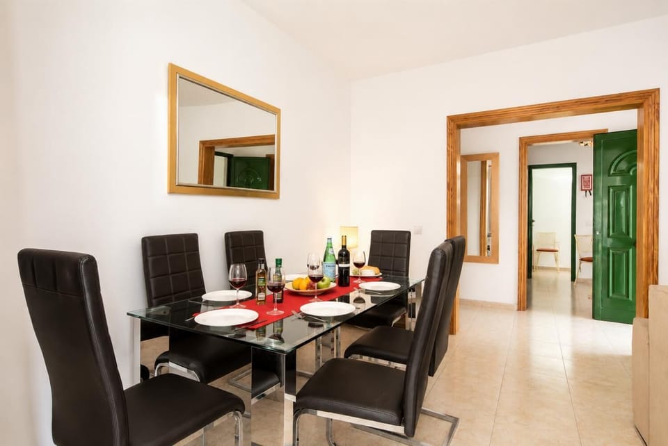 Living room with sofas, dining area, WiFi internet, satellite TV, and DVD player