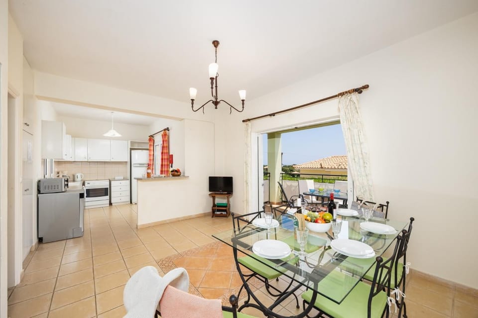 Dining room with kitchen, A/C, WiFi internet, and satellite TV