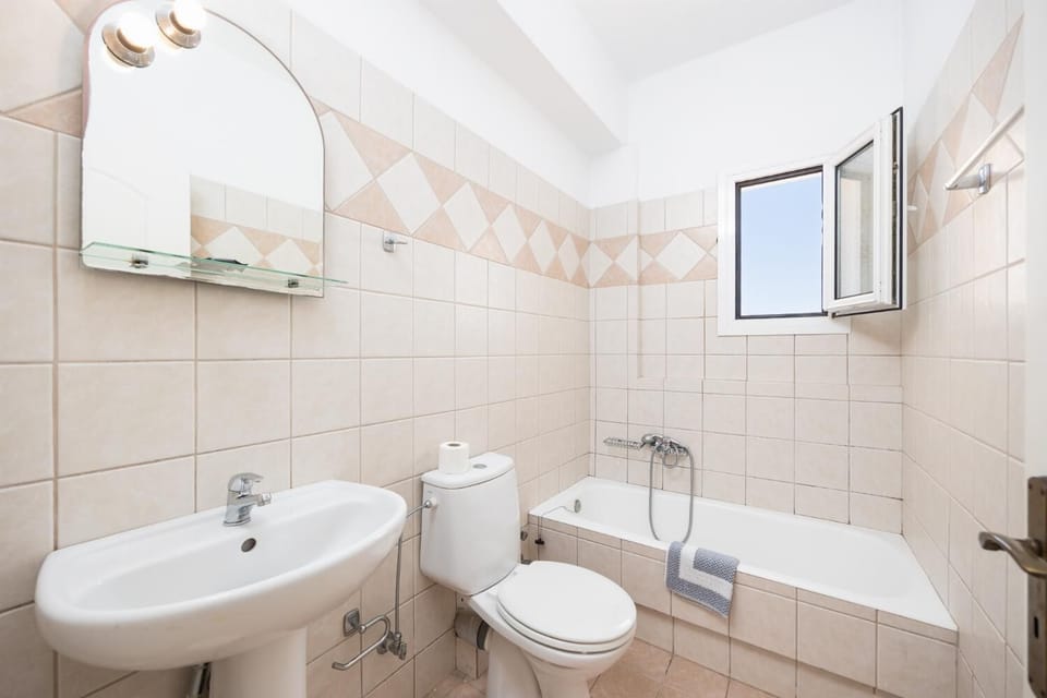 Family bathroom with bath and shower