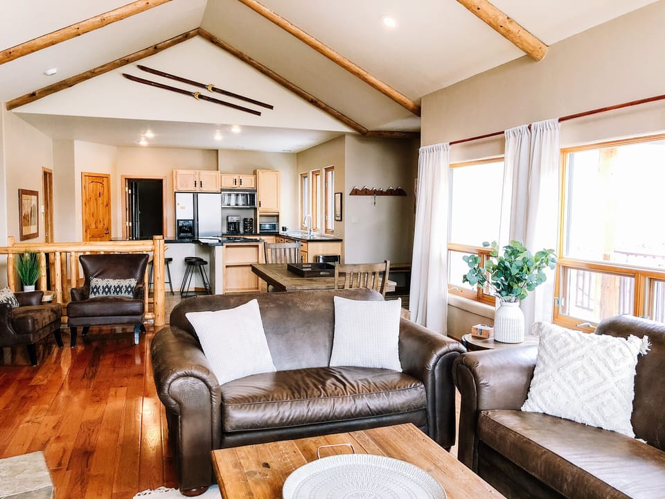 Great Room living space. Wood-burning fireplace and plenty of seating options. 