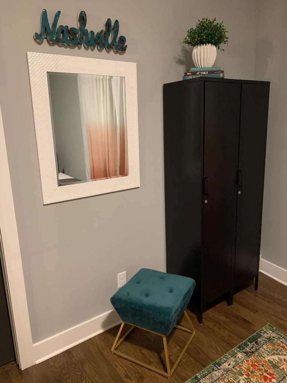 Bedroom with a spacious wardrobe and a stylish wall mirror