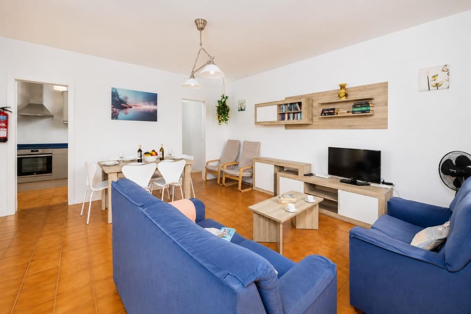 Living room with sofas, dining area, WiFi internet, and satellite TV