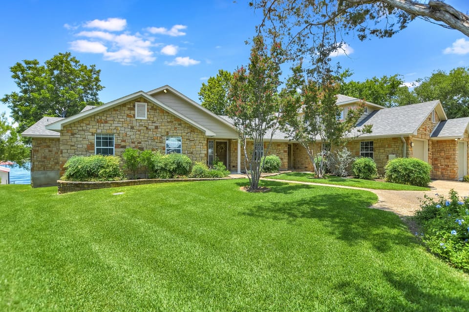 Spacious front yard with room to park boat trailer on other side