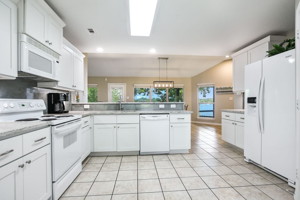 Fully stocked kitchen, granite countertops. Full size washer/dryer