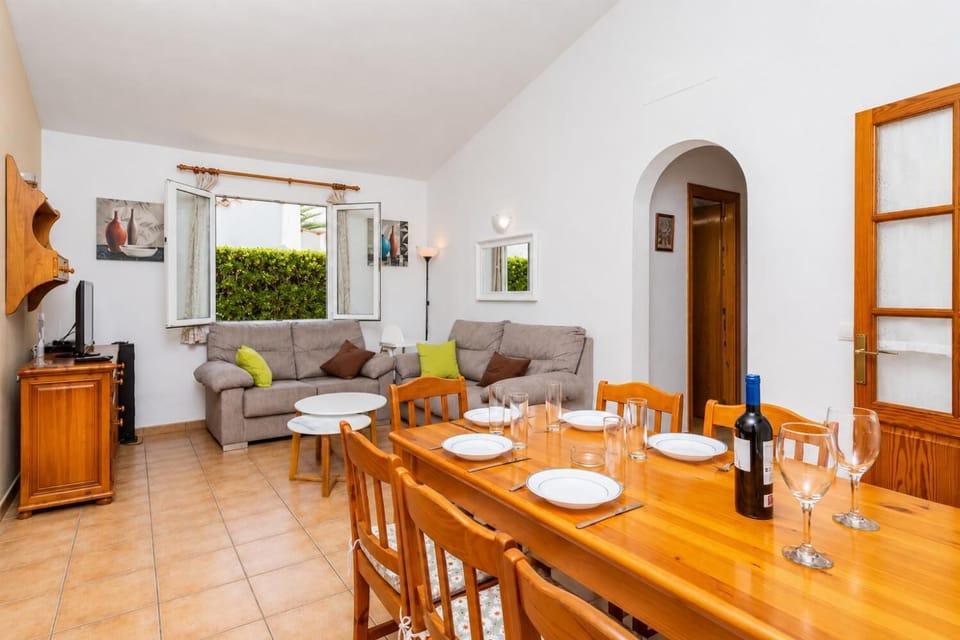 Living room with sofas, dining area, WiFi internet, satellite TV, and terrace access