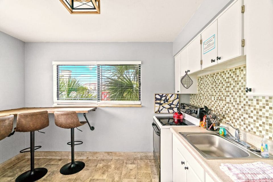 Boutique Beach Retreat Full Size Kitchen and seating area with Refrigerator  Oven Range, Coffee Maker Utensils, dishes and cooking basics