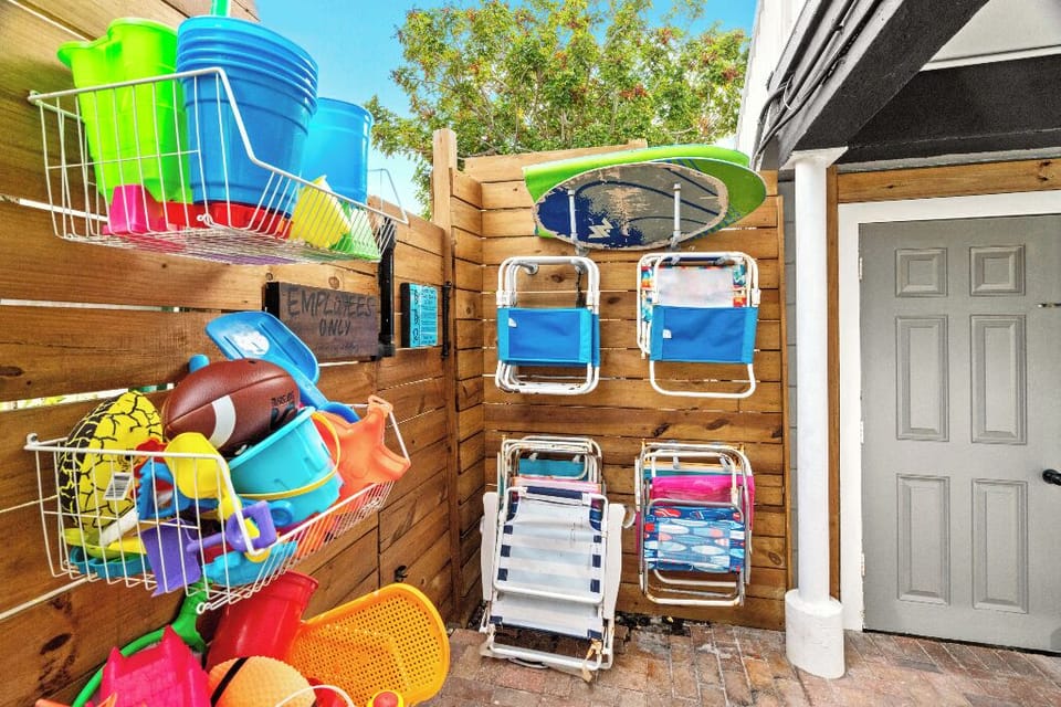 Boutique Beach Retreat Pool area, Lounge chairs, table, Propane grill, pool and beach toys and chairs