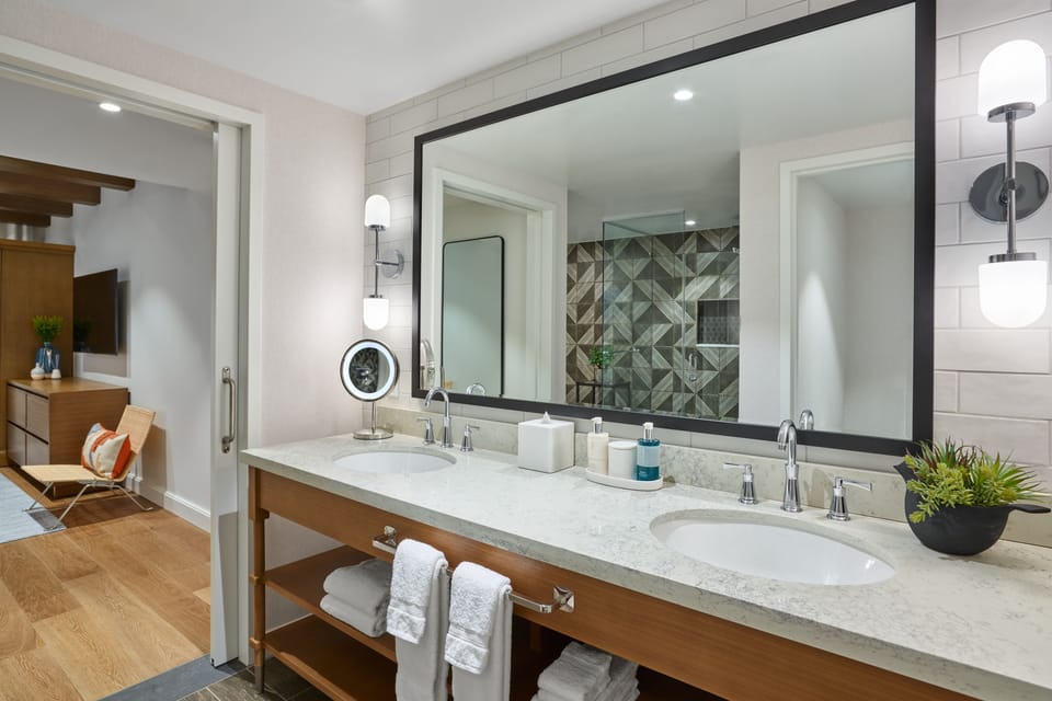 Designer toiletries, hair dryer, bathrobes, slippers