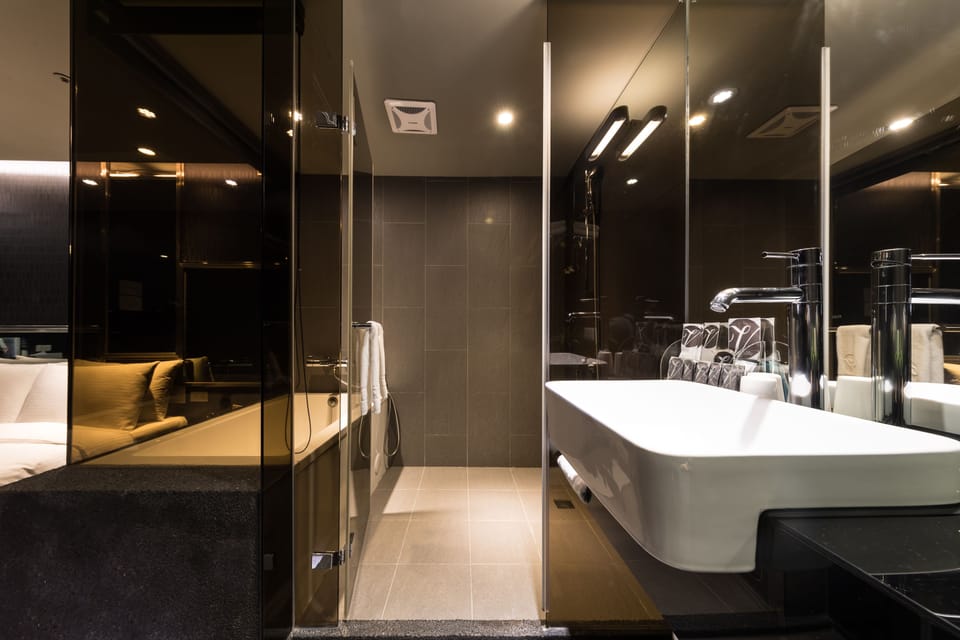 Triple Room, No Windows | Bathroom | Rainfall showerhead, free toiletries, hair dryer, slippers