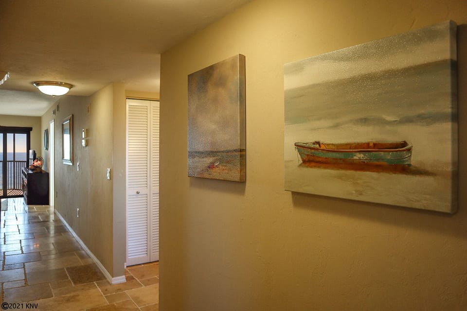 Beautiful Entry includes artwork, a mudroom and a view to the Gulf.
