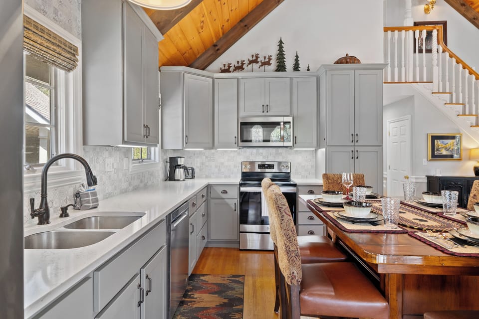 Modern fully equipped kitchen with dining area.