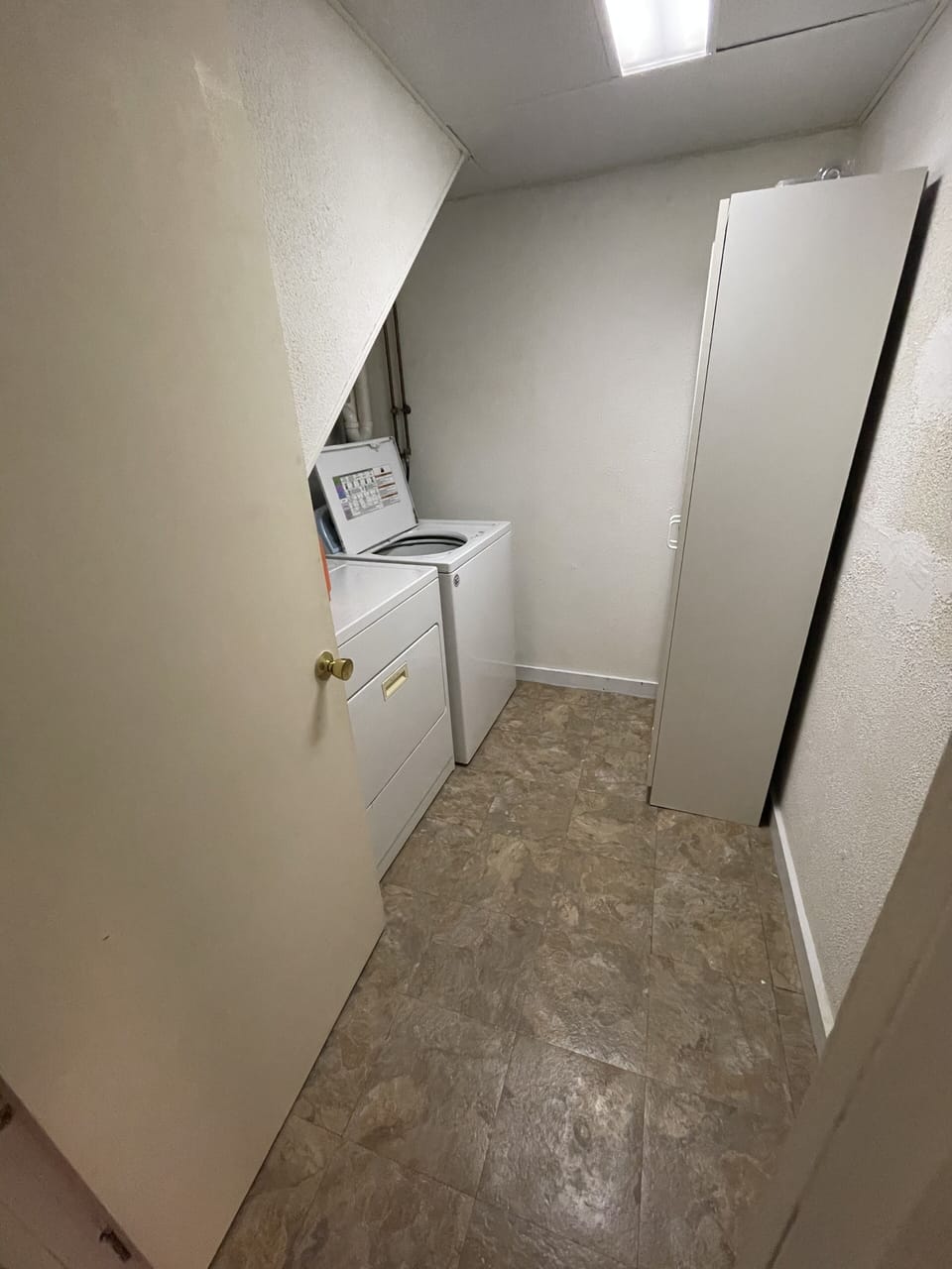Laundry room off kitchen. 
