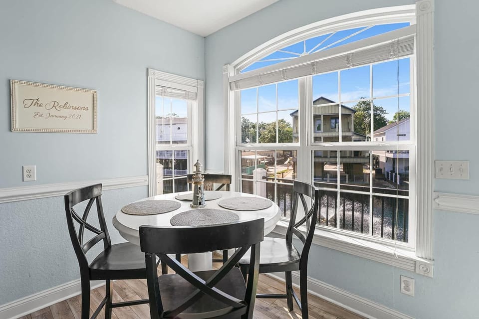 Bright breakfast nook with scenic waterfront views