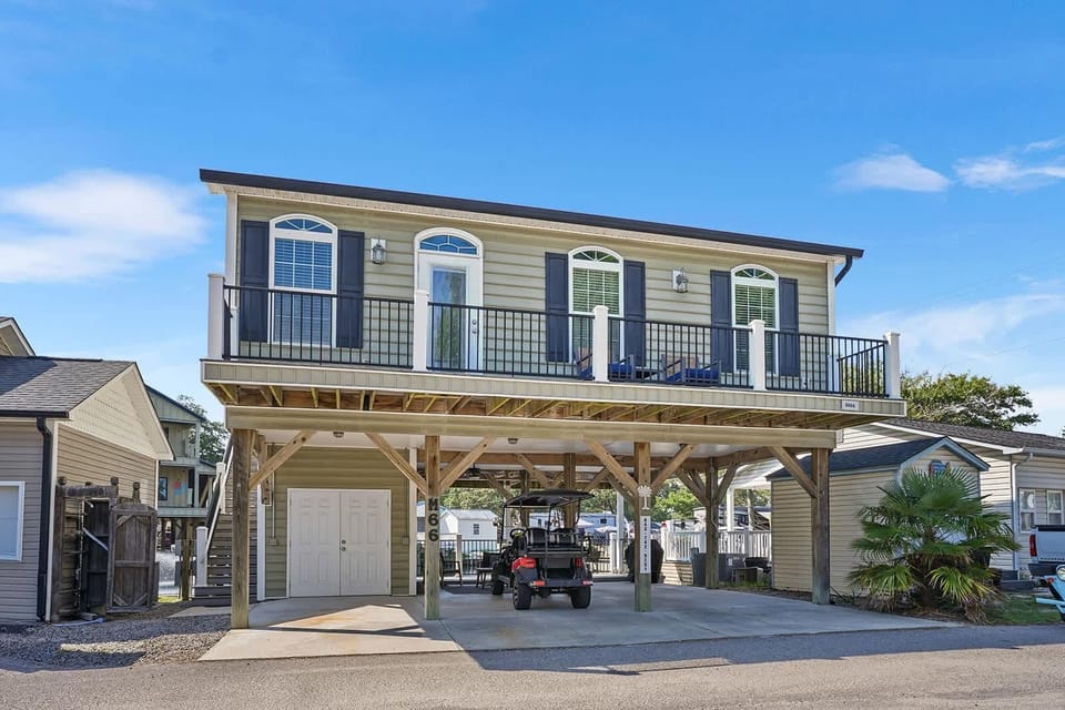 Spacious elevated home with covered parking and balcony views