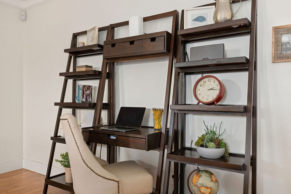 Desk and shelving unit in the living room for those needing to work remotely!