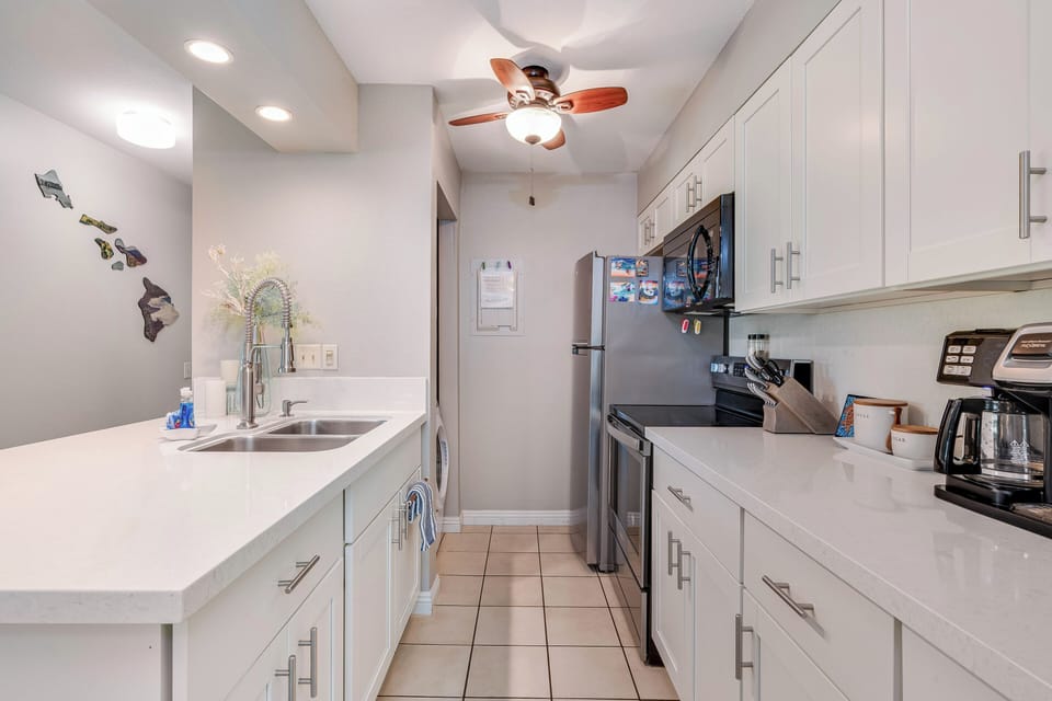 The kitchen has ample space to prepare fresh island meals.