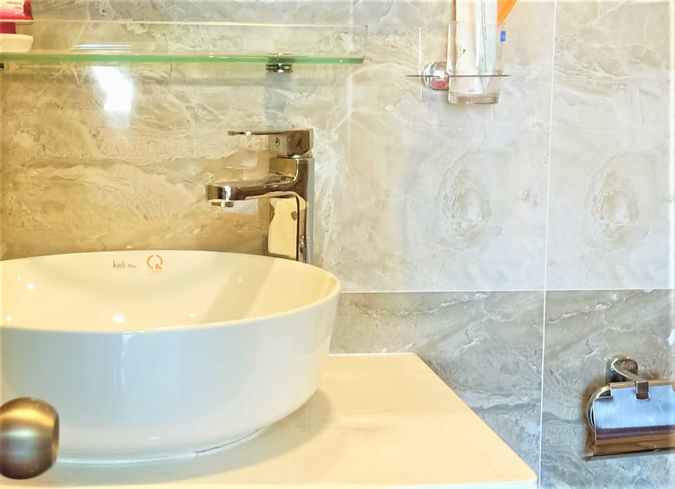 Shower, free toiletries, hair dryer, slippers