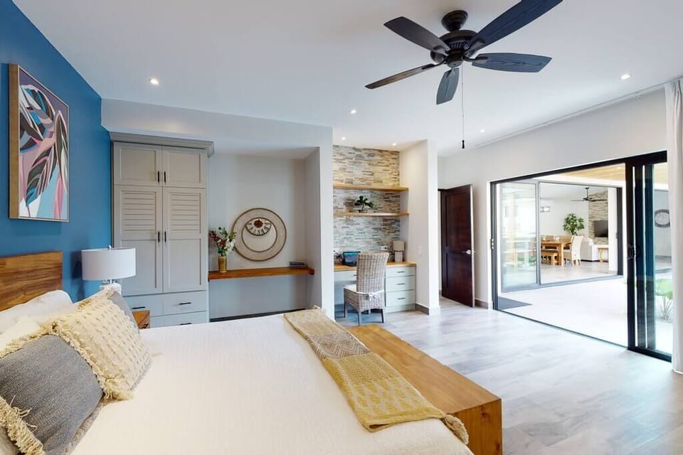 Master bedroom opens out to the pool area to allow the ocean breeze in. 