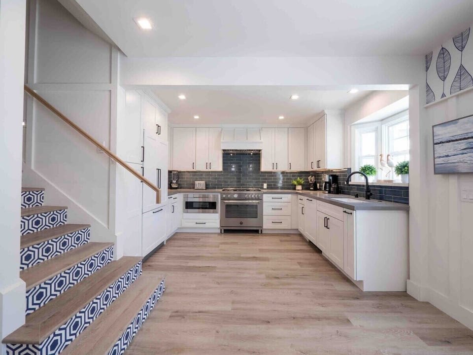 Modern kitchen with Bertazzoni oven and Fisher Paykel refrigerator and dishwasher. Coffee Maker. Blender, Toaster provided.
