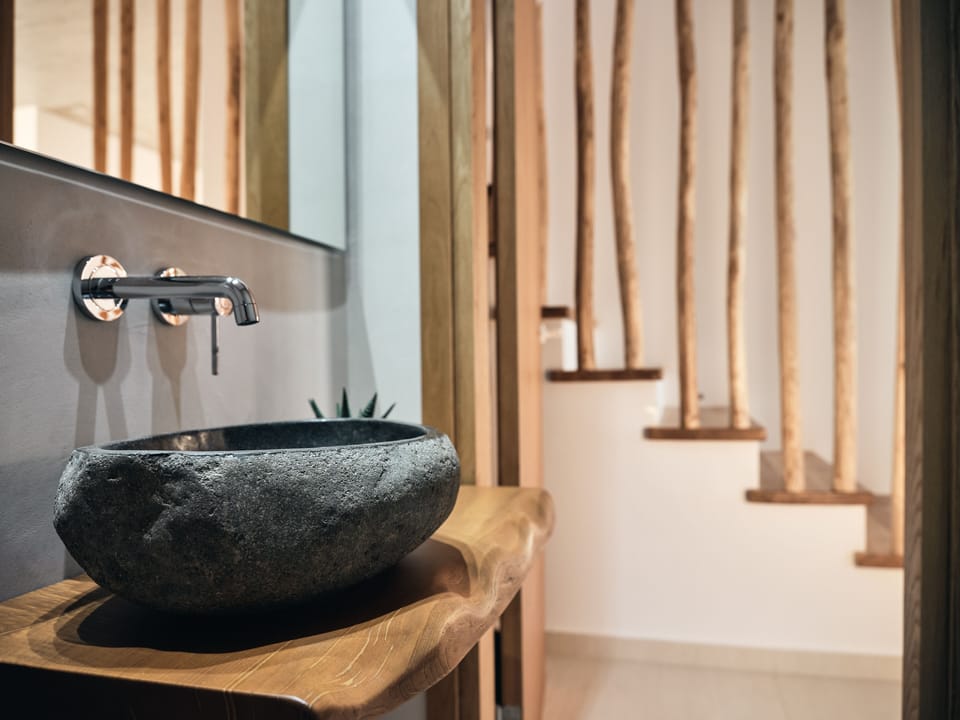 Light wood & brass accents adorn in this sensory villa.