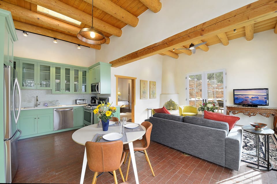 Casita living room and kitchen - Kiva wood burning fireplace. Wood not provided.
