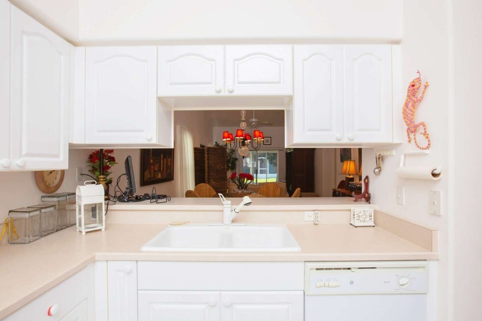 Kitchen sink faces out towards main living space.