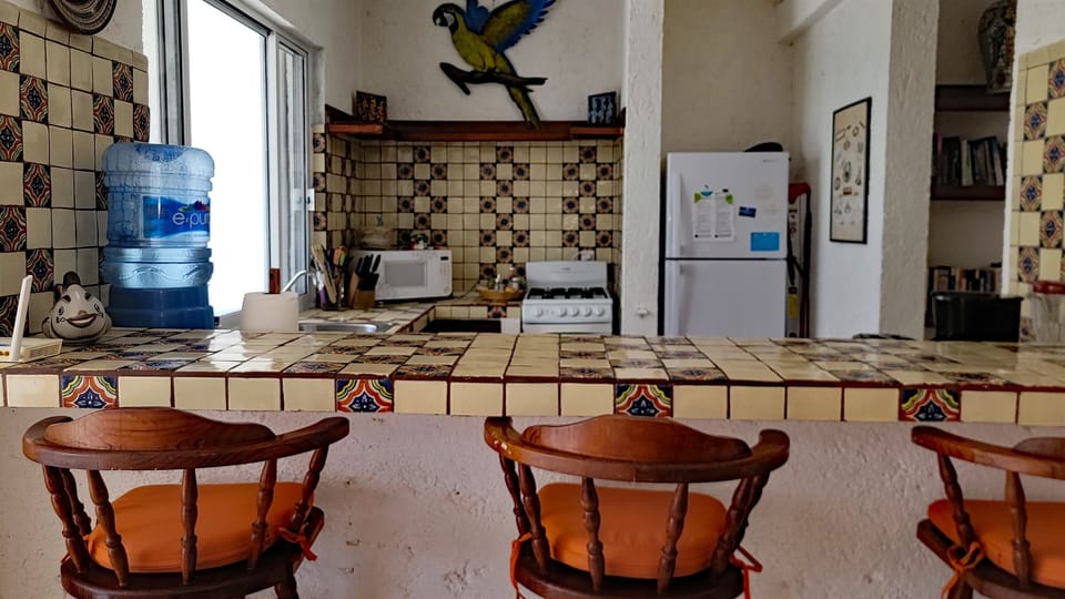 Looking From The Dining To The Kitchen w/ It's Bar Makes For Open Entertaining