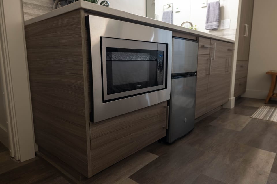 Bedroom has microwave and mini fridge