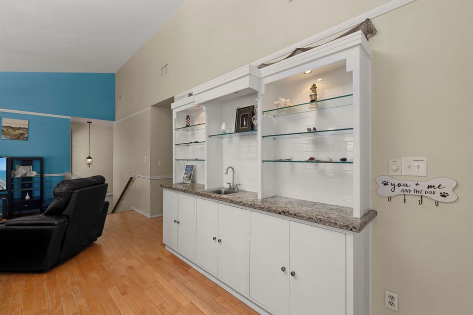 The wet bar adds a touch of convenience and style, perfect for mixing drinks or serving refreshments during your stay!