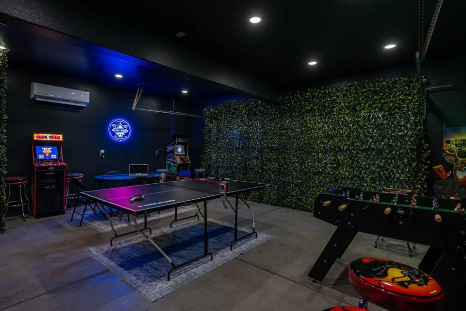 Game room: completely brand new garage converted game room with (4) arcade games, ping pong table, poker table, foosball, and split AC unit