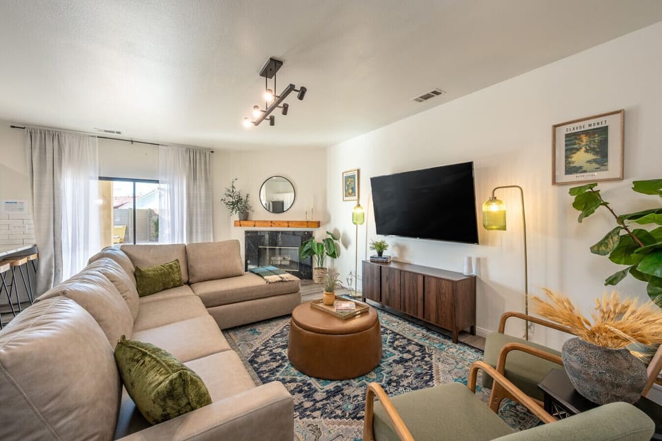 Living room: sectional with additional seating, fireplace and 75` smart tv