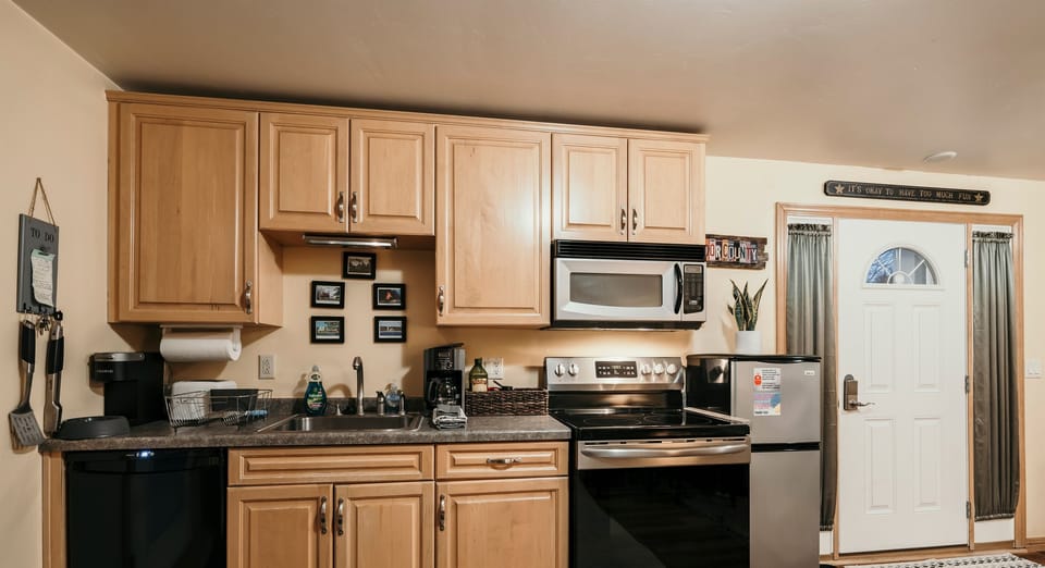 Open, fully equippted kitchen with 2 refrigerators, stove, oven, and microwave!